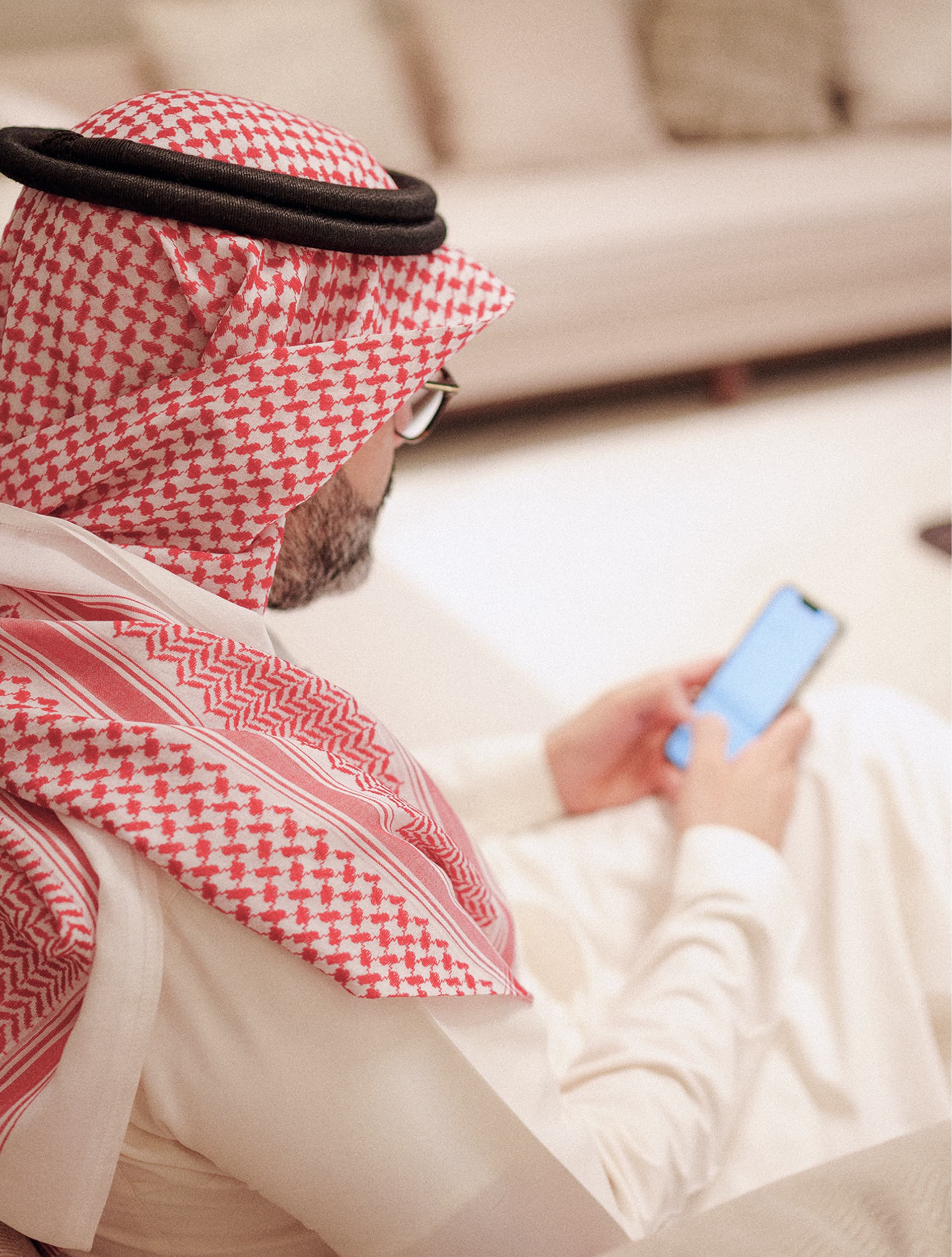 A man working on a phone and laptop